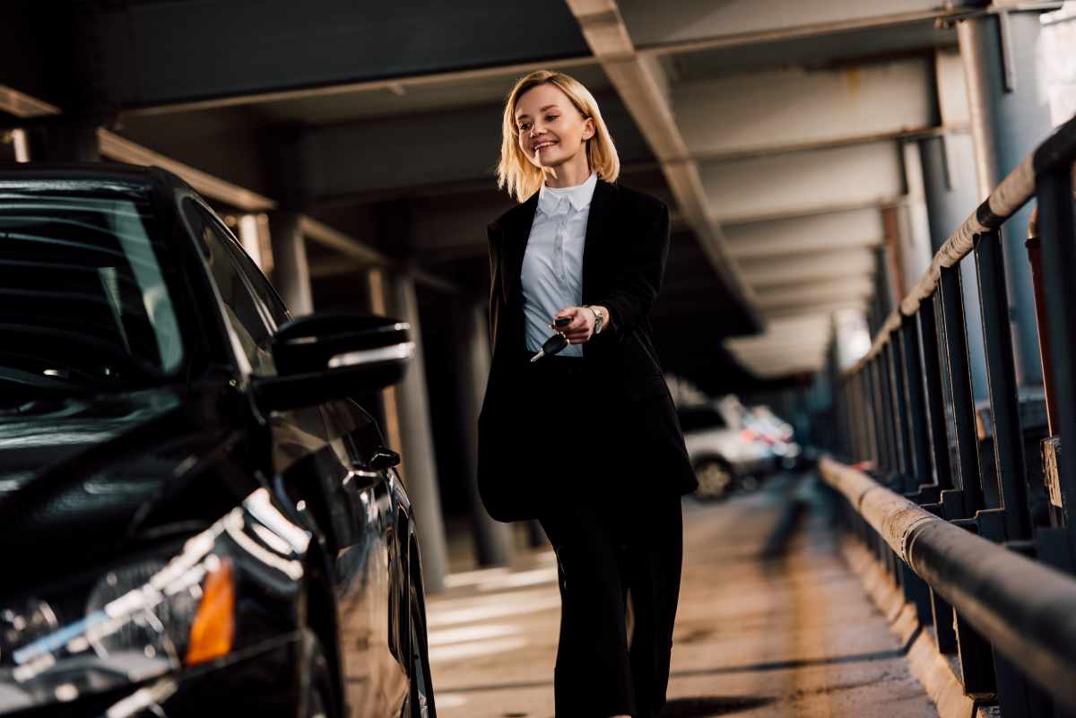 cheerful attractive blonde woman walking near blac 2024 11 12 23 06 54 utc (1)